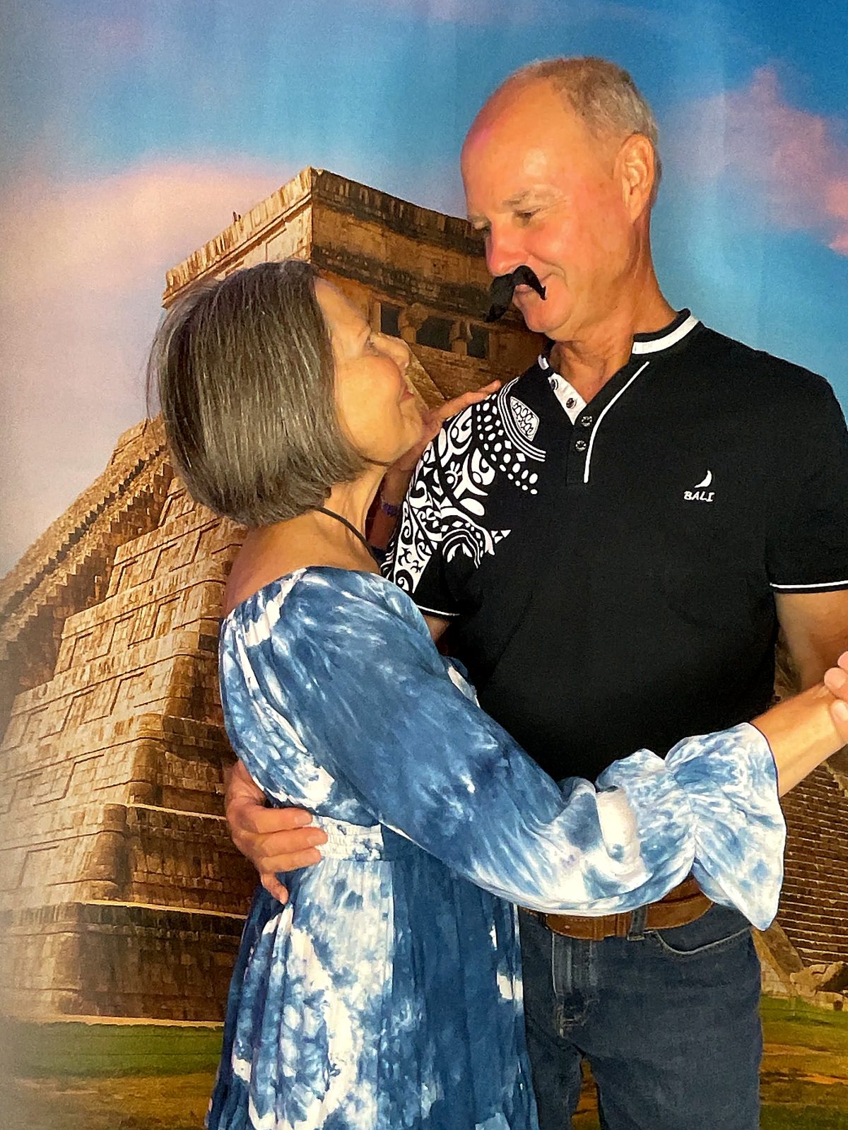 A couple dancing at the Pinot Portraits photo booth